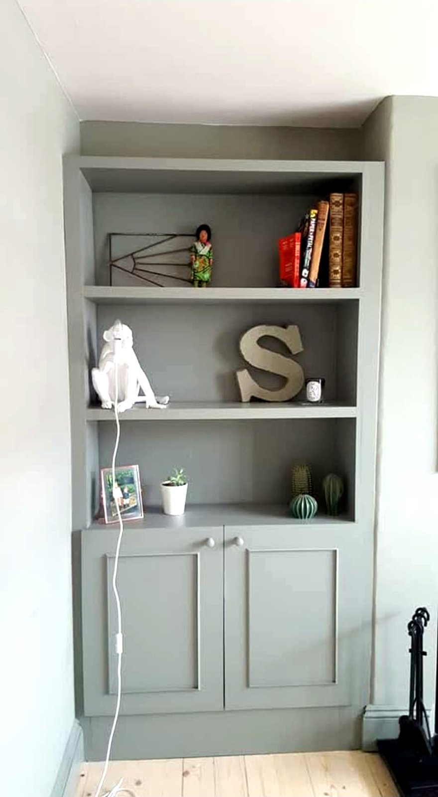 Bespoke alcove shelving with storage cupboard by SG Carpentry Wallingford